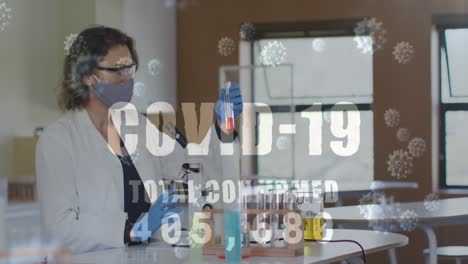 Animation-of-word-covid-19-total-confirmed-rising-and-cells-with-masked-woman-in-lab