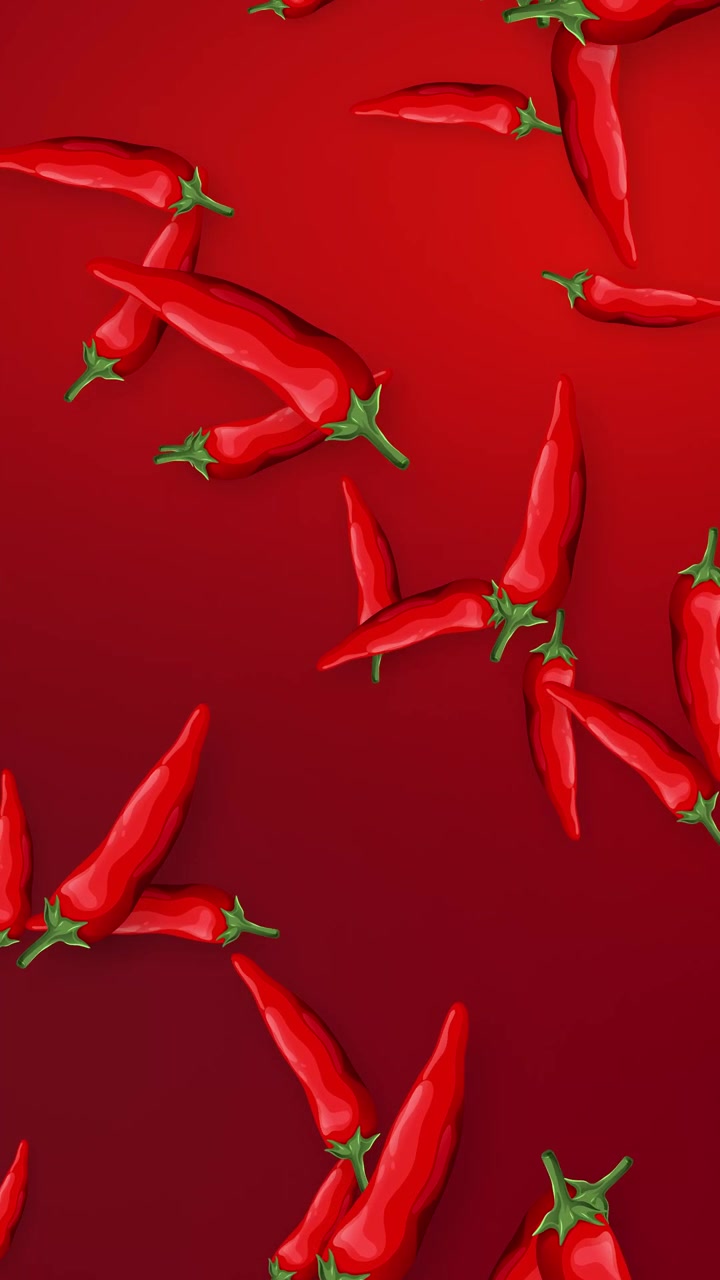 Red Chili Peppers Falling Against a Solid Red Background