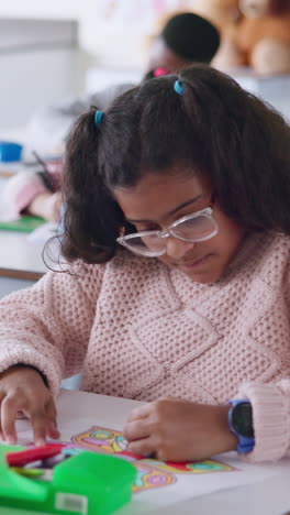 young girl drawing in a classroom