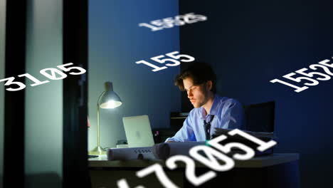 animation of data processing over caucasian businessman using laptop in office