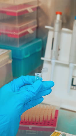 hand holding test tubes in laboratory. close up of test tube for taking patient specimen sample