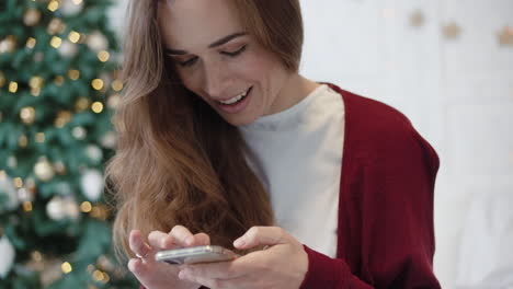 busy woman looking smartphone at home