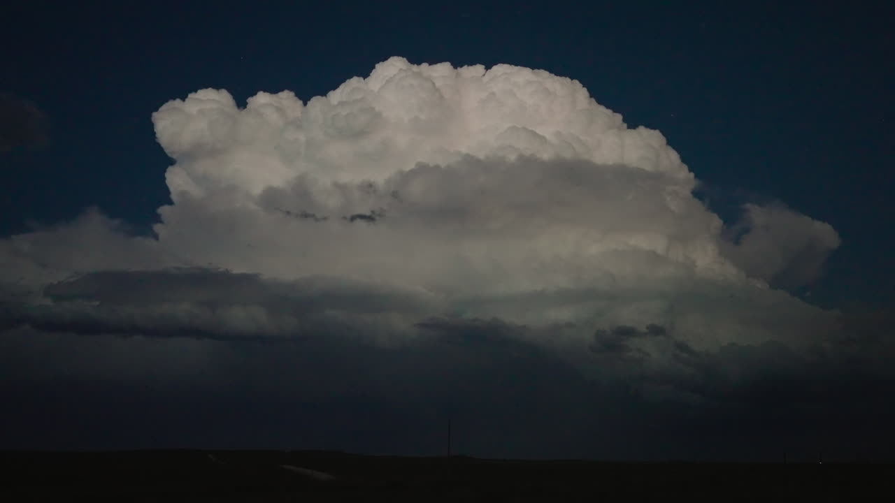 Illuminated sky with powerful lightning bolts during an intense thunderstorm