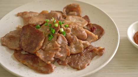 grilled-pork-neck-sliced-on-plate-in-Asian-style