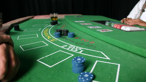 betting chips and placing stakes in a poker game at a casino