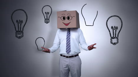 hombre de negocios escondiendo la cabeza con una caja feliz