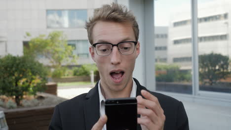 man receiving news on phone, looking surprised and shocked