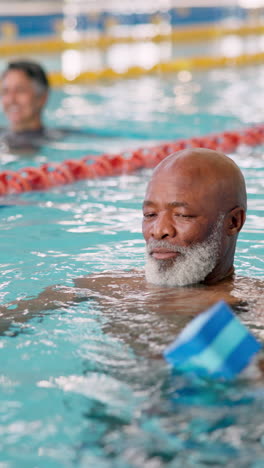 a senior man enjoying water aerobics in a pool