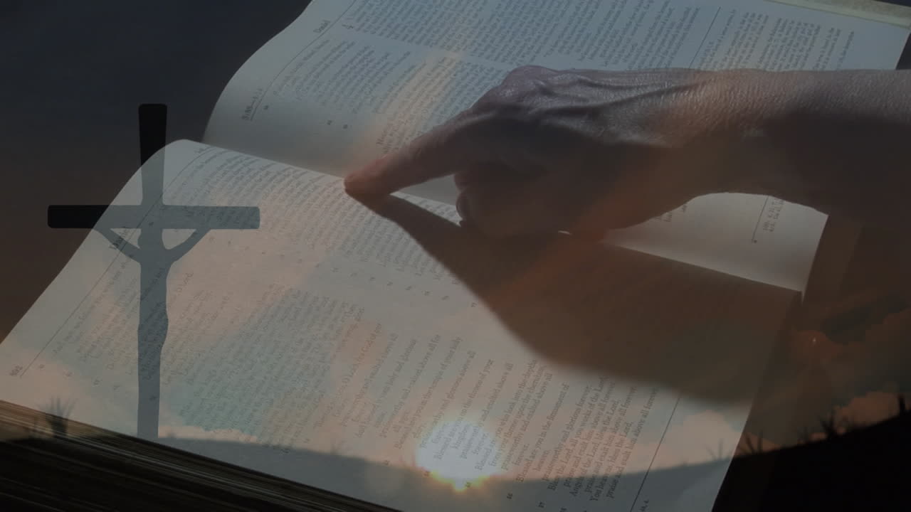 キリスト教の十字架と聖書に指を当てた人のアニメーション