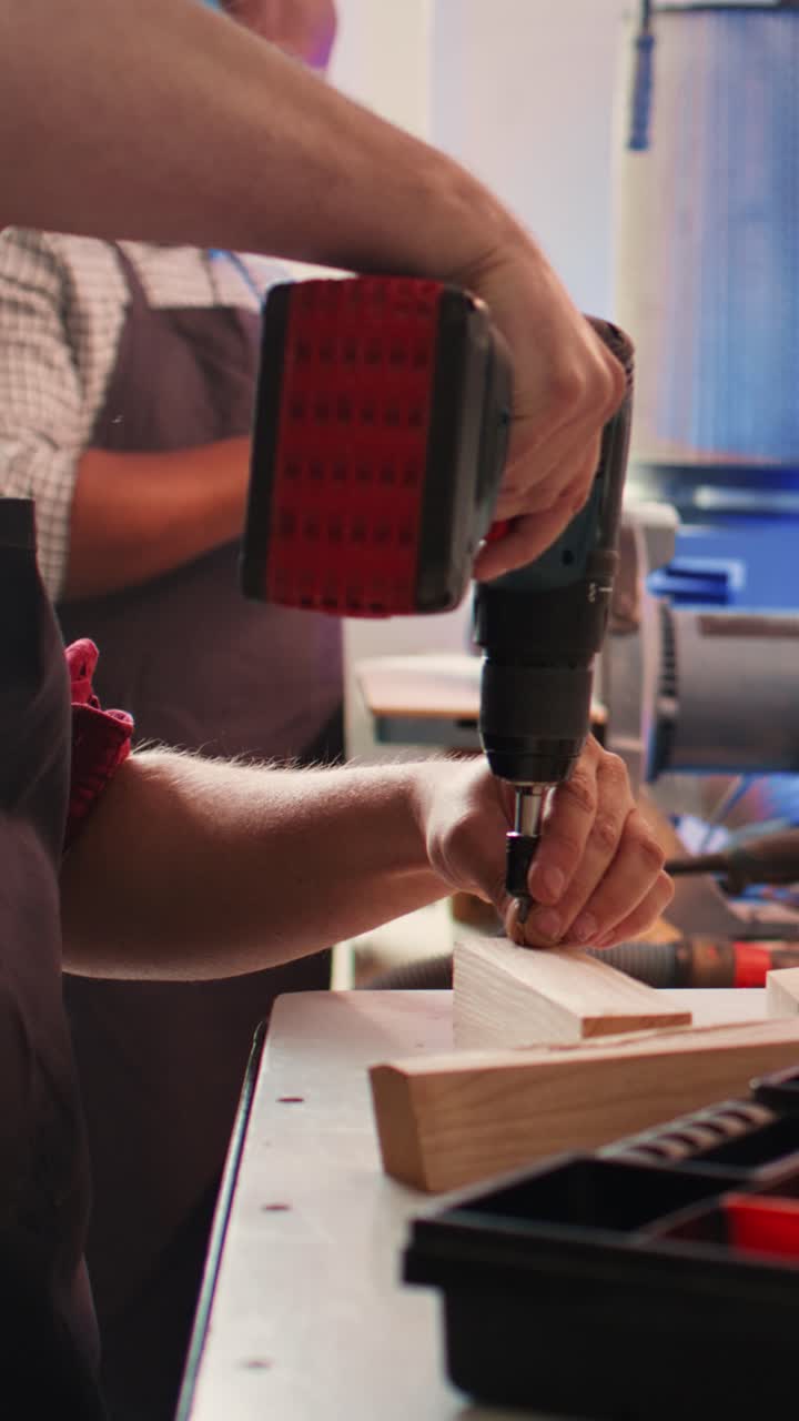 Man Drilling Hole into Wood with Power Tool
