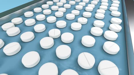 white pills on the conveyor line of pharmaceutical factory moving for packaging