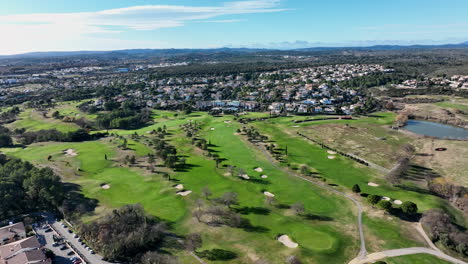 Aerial-view-over-Golf-Montpellier-Fontcaude-on-a-sunny-day,-showcasing-Montpelli