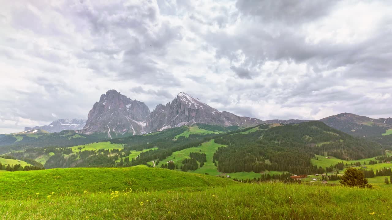 Cloud time lapse over Mt Sassolungo, Seiser Alm Alpine meadow Dolomites