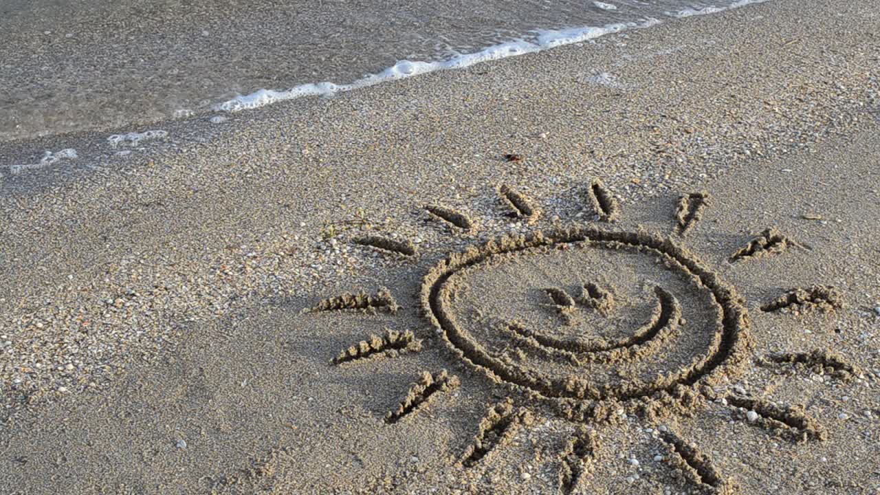 Sun drawing on the beach. Beach and drawing