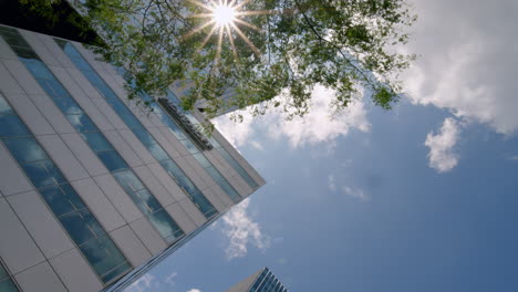 looking into modern architecture facade during sunny day in the business area zuidas in amsterdam, the netherlands