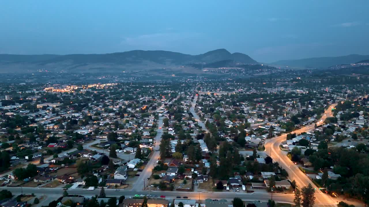 Explore Kelowna's infrastructure expansion and future economic trends through stunning 4K aerial footage, showcasing urban development and growth potential.