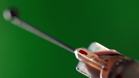 close-up of a needle with blood