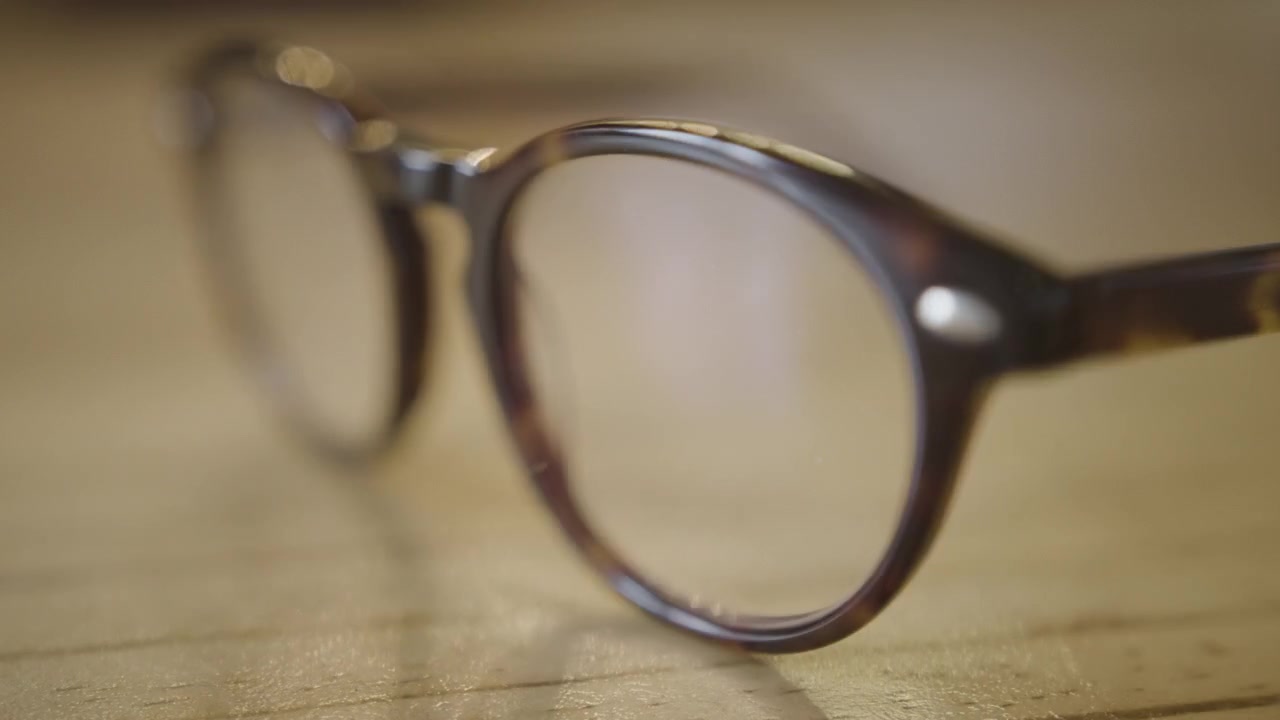 Close-up of a Pair of Glasses Laid Down on a Table