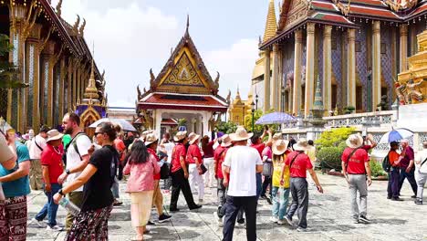 visitors explore the temple grounds in bangkok