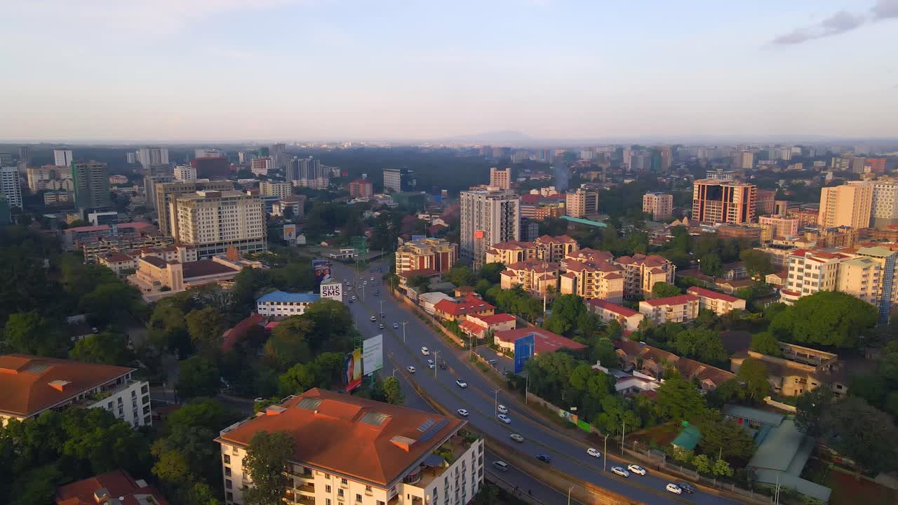 Nairobi Cityscape at Sunset: Aerial View of Buildings, Roads, and Green Trees in Kenya, Africa