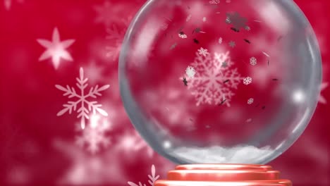 Animación-De-Globo-De-Nieve-Navideño-Con-Nieve-Cayendo-Sobre-Fondo-Rojo.