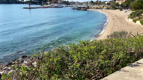 Sandy-Shoreline-Of-Plage-Cros-Dei-Pin-Near-The-Lighthouse-In-Saint-Jean-Cap-Ferrat,-France