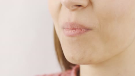 woman eating pistachio in close-up. nuts.