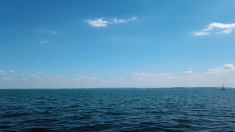 time lapse of water traffic on lake balaton on a cloudy day, filmed from the shore of balatonfüred
