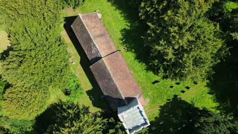 a top-down aerial roll shot of lady magdalene church in denton, kent