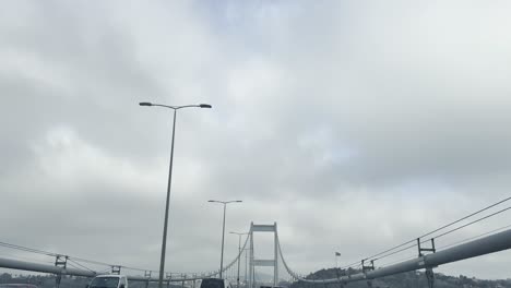 images of vehicles crossing from the european continent to the asian continent on the bosphorus bridge in istanbul