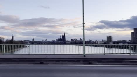 cologne skyline in the evening from a bridge