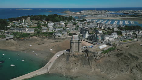 Drone-descending-towards-Solidor-tower-at-Saint-Malo,-Brittany-in-France