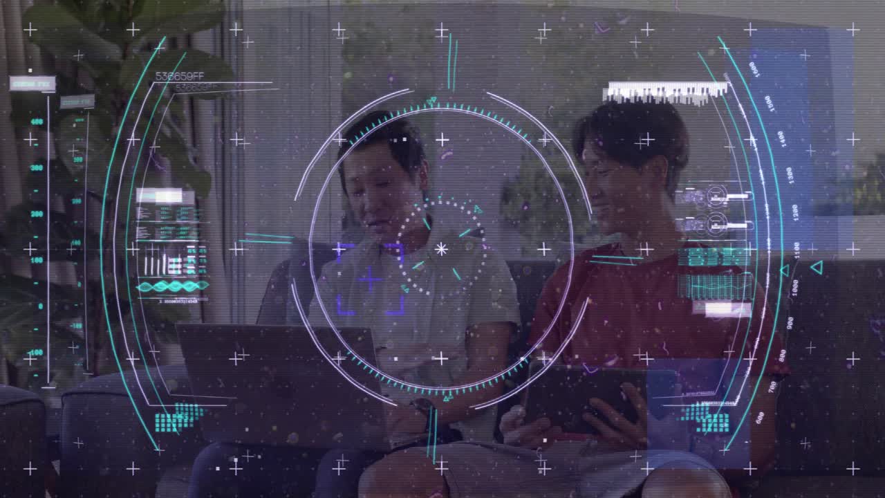 Teen turning tablet toward father, man pausing typing and pointing, sharing content with tech HUD