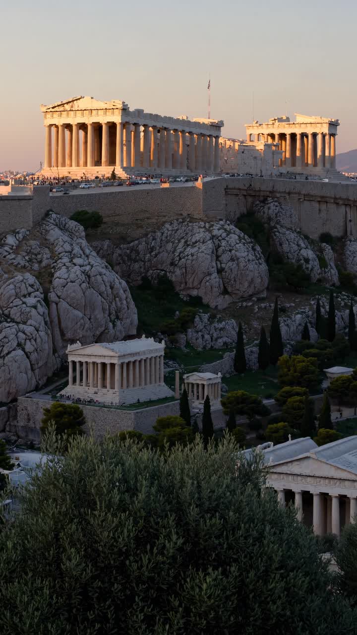 Aerial view of the Acropolis at sunset, showcasing ancient architecture and dramatic lighting