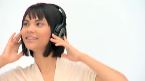 cute asian woman listening to music