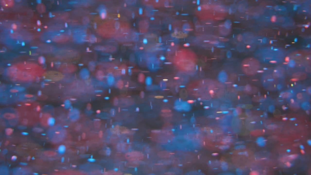 fondo retro festivo brillante. partículas de movimiento borroso caótico. planetas de la galaxia espacial. superficie en cámara lenta. bucle de fondo bokeh de efectos únicos de lente vintage de burbuja. superficie fantástica.