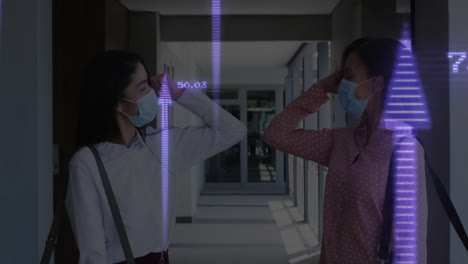 wearing masks, two people in school greeting with animation data graphics overlay