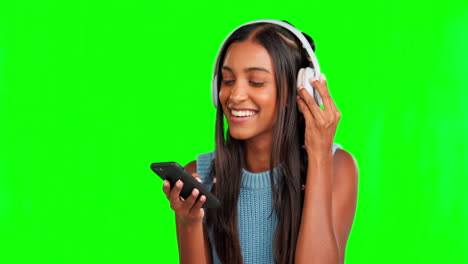 Green-screen,-headphones-and-woman-on-her-phone
