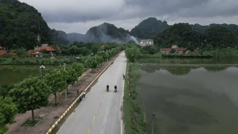 Drone-shot-of-guys-on-motorcycles-in-the-mountain-range-of-Vietnam