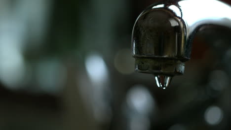 water running from a chrome tap