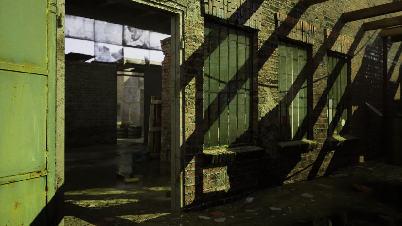 Abandoned warehouse interior with sunlight casting shadows on walls