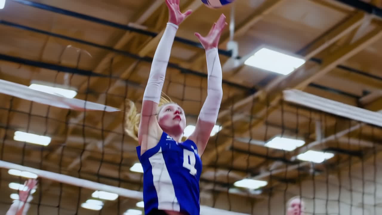 Dynamic shots of female volleyball players in action during a game, demonstrating skills like jumping, spiking, and blocking at the net