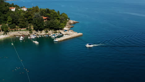 fishing vessel sailing approaching adriatic seaport in moscenicka draga, croatia