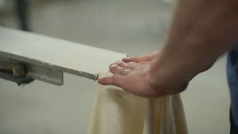 Man-Places-T-Shirt-Pocket-on-Screen-Printing-Machine