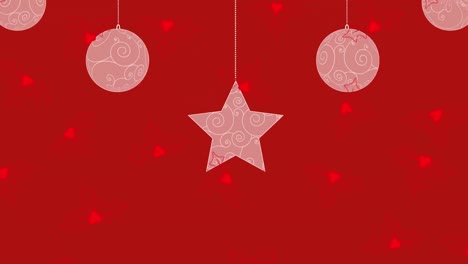 animation of christmas decoration and red holy falling on red background