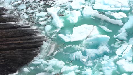 large pieces of ice floating in water after glacier calving, close up