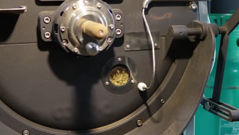 watch as coffee beans transform during the roasting process in a coffee shop.