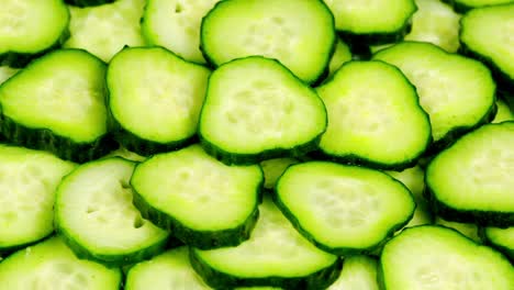 fresh green cucumber. spinning slowly in a circle. macro background