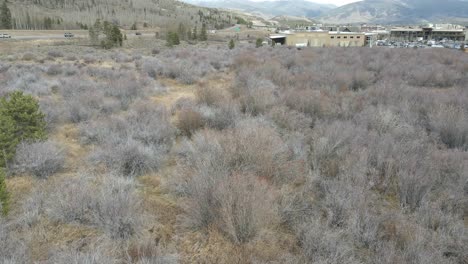 Aerial-tilt-up-shot-of-a-field-along-Interstate-70