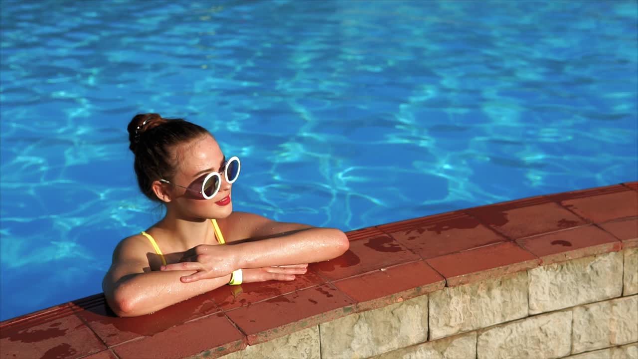 Teenage Girl Relaxing by the Pool